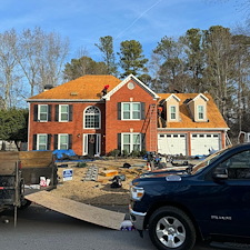 Elite-Roofing-Systems-Upgrades-Dunwoody-Home-with-GAFs-Timberline-HDZ-Architectual-Charcoal-Black-Shingles 0